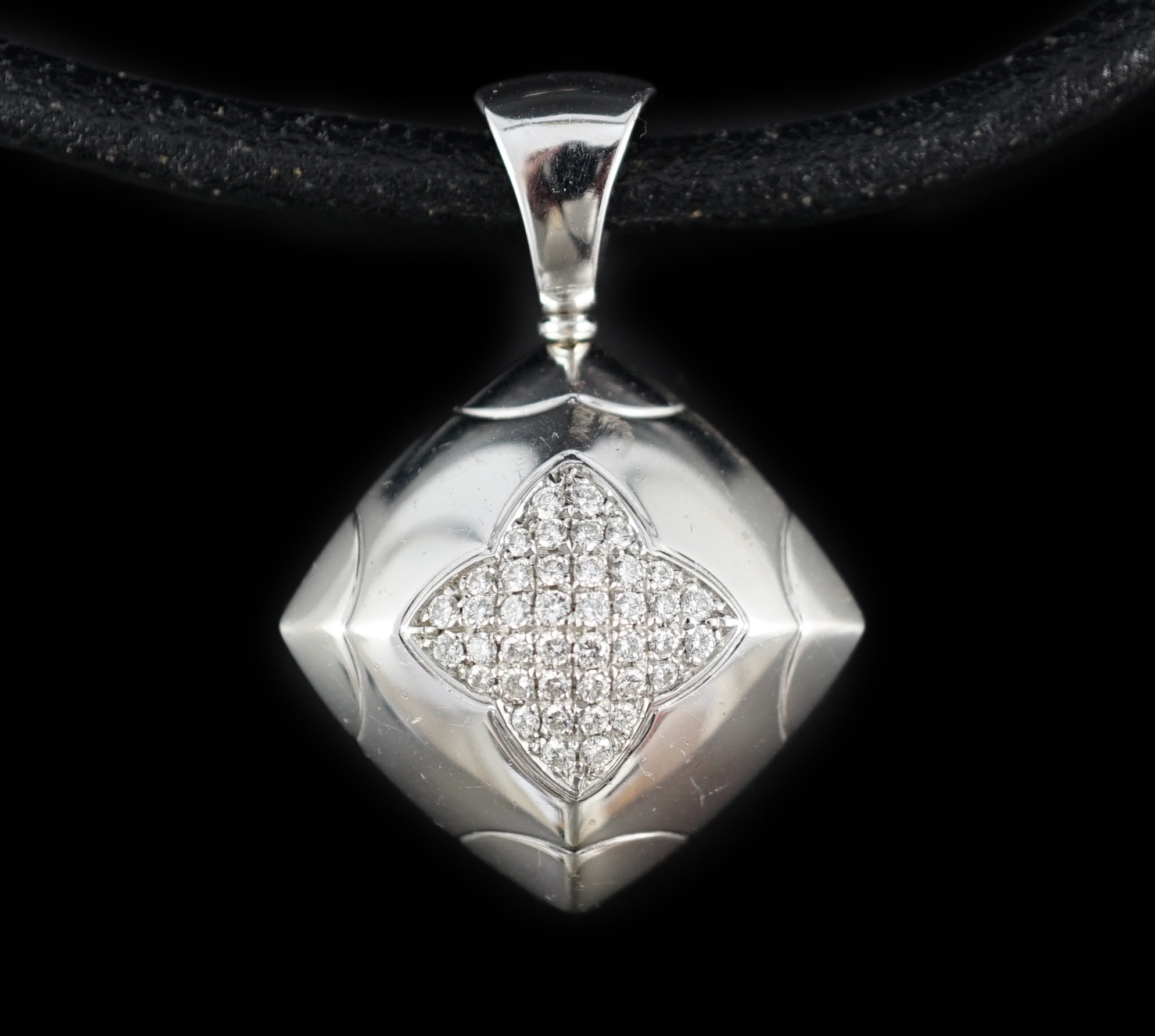 A modern Italian Bulgari 18ct white gold and pave set diamond pendant, on a Bulgari 18ct white gold mounted chord necklet